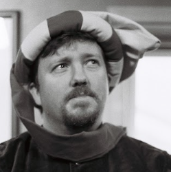 A picture of me wearing a doublet and one of my trademark silly hats. Photo credit: Allan Leeson